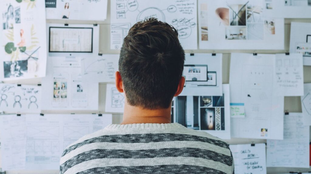 Male Entrepreneur Looking at His Vision Board