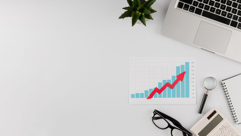 Office desk with a growth chart graph on the desk