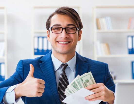 Corporate employee happy to receive a holiday bonus